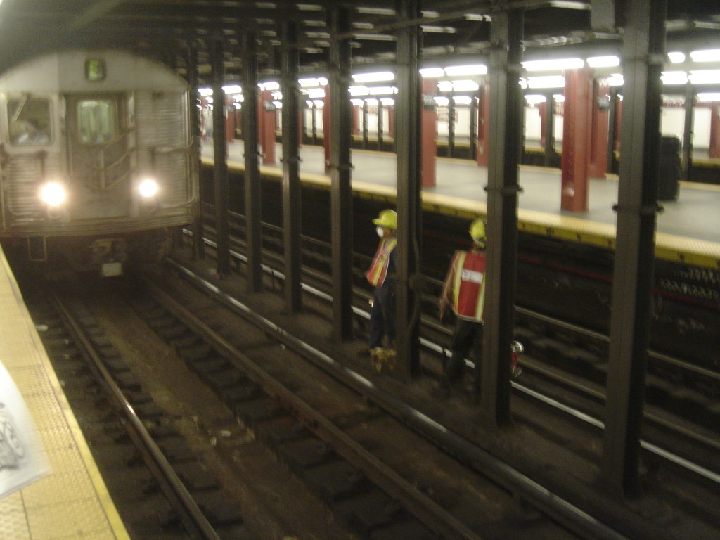 Construction_workers_on_subway_track_at_34_St-Penn_Station